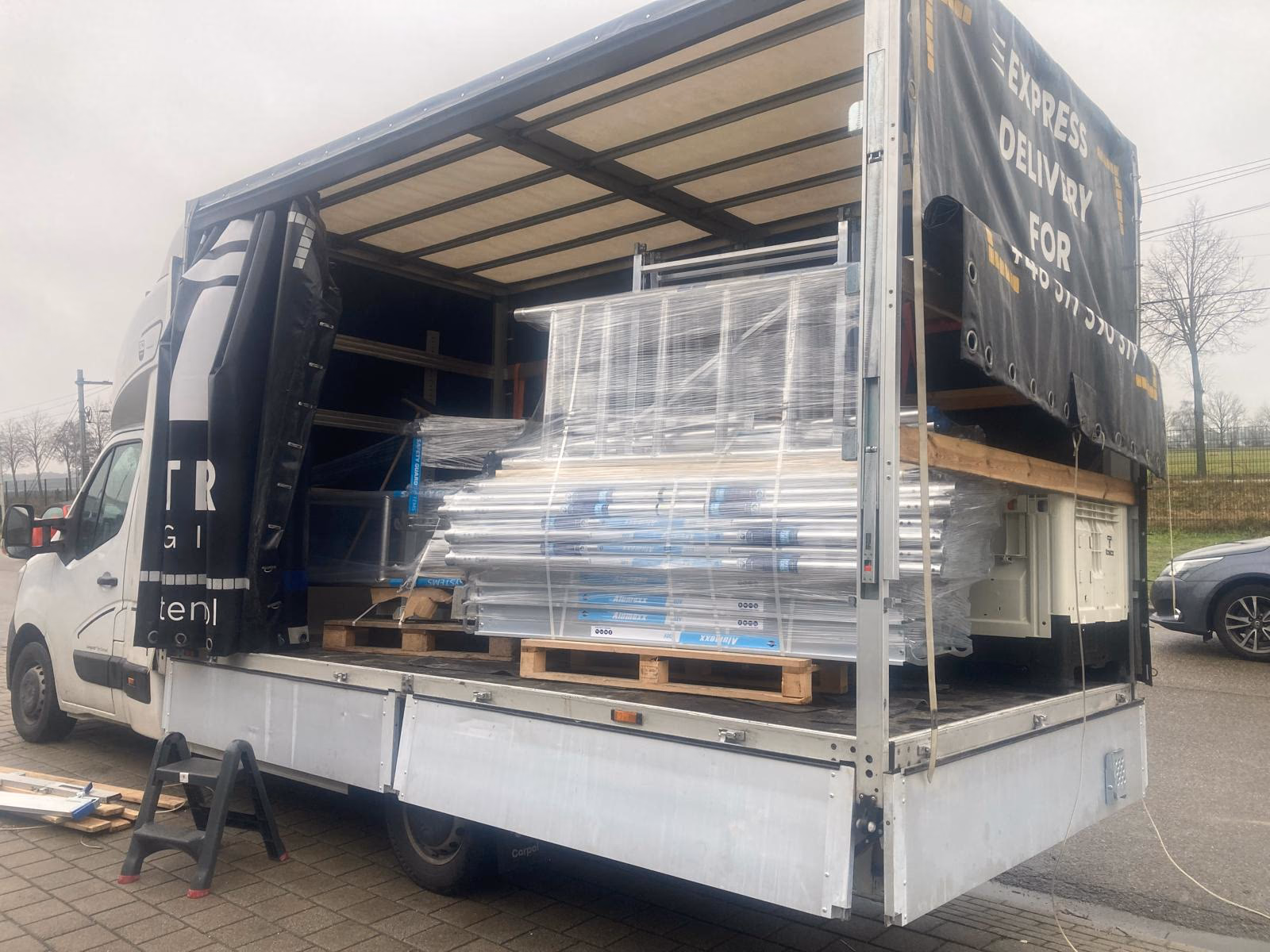 International cargo loaded into a Pretentor Logistics curtain-side vehicle